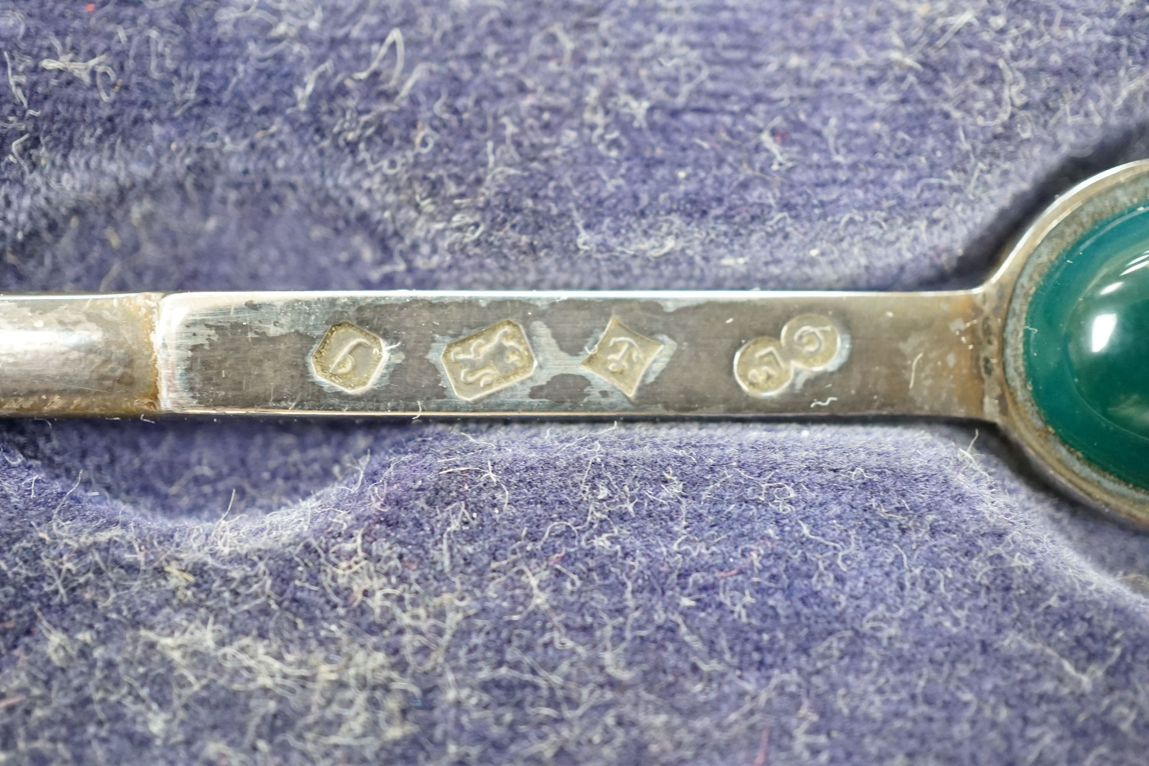 A group of small silver to include two vesta cases, a hand mirror, paste pin and a cased button hook and shoehorn.